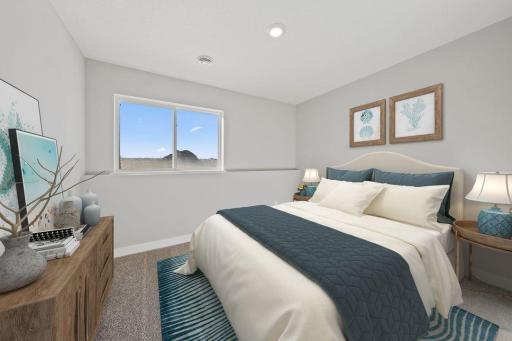 Tucked down in the lower level, and away from the hustle and bustle of the main level living spaces, this bedroom resides adjacent to a full bath and serves as the perfect guest room or your home office! Photo is of similar staged home.
