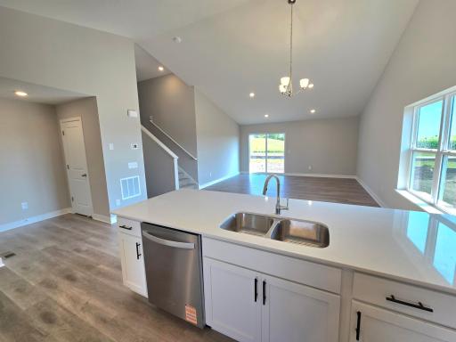 The Rushmore Kitchen shown with White cabinets at Highlands at Eagle View in Elko New Market. Photo is of actual home. Options and colors may vary. Ask Sales Agent for details.