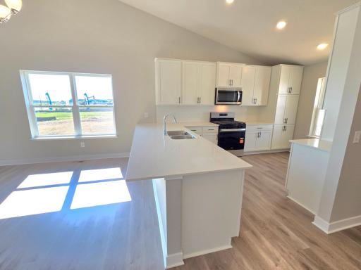 The Rushmore Kitchen shown with White cabinets at Highlands at Eagle View in Elko New Market. Photo is of actual home. Options and colors may vary. Ask Sales Agent for details.