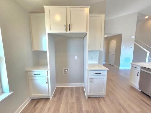The Rushmore Kitchen shown with White cabinets at Highlands at Eagle View in Elko New Market. Photo is of actual home. Options and colors may vary. Ask Sales Agent for details.