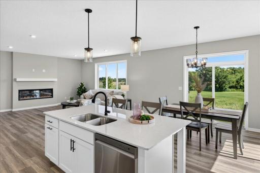 PHOTO OF A DIFFERENT HOME WITH SIMILAR PLAN AND FINISHES.