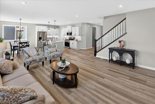 PHOTO OF A DIFFERENT HOME WITH SIMILAR PLAN AND FINISHES.