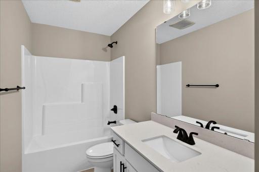 PHOTO OF A DIFFERENT HOME WITH SIMILAR PLAN AND FINISHES. Upper Full Bathroom.