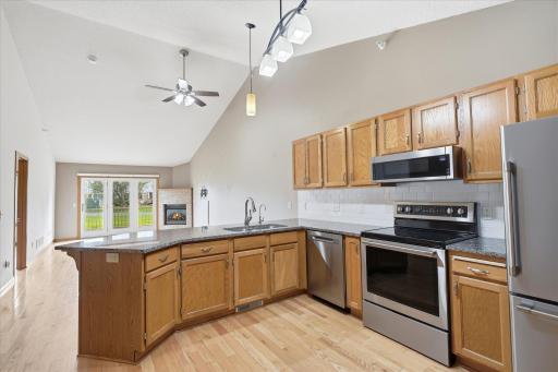 Vaulted main floor Kitchen, Living and Dining Room areas create open layout