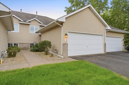 Spacious 4 Bdrm 2 Bath updated townhome with maint-free deck and two car garage