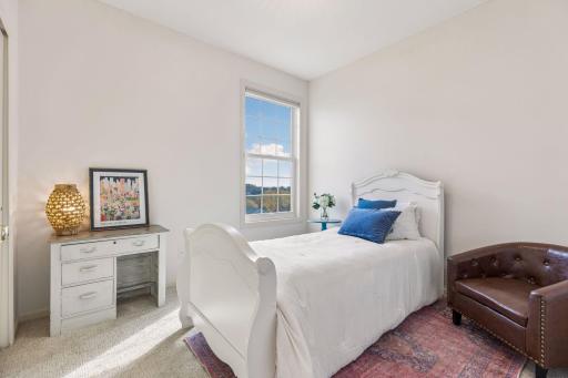 The third bedroom offers flexibility for sleeping space or a home office.
