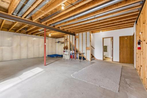 Room to envision a fourth bedroom, future family room, home gym, or recreation space.