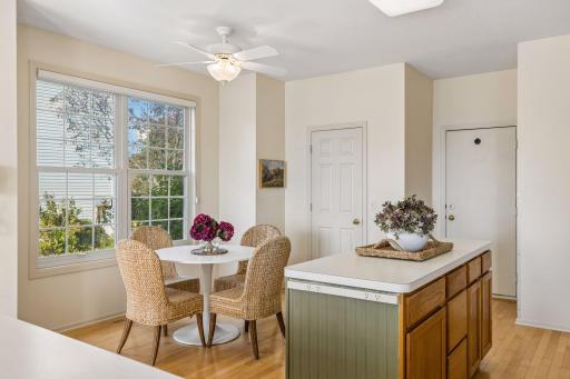 A dining nook beside the window keeps everyday meals close to the kitchen.
