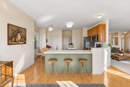 Tons of seating in the kithen, including room for stools at the kitchen counter.