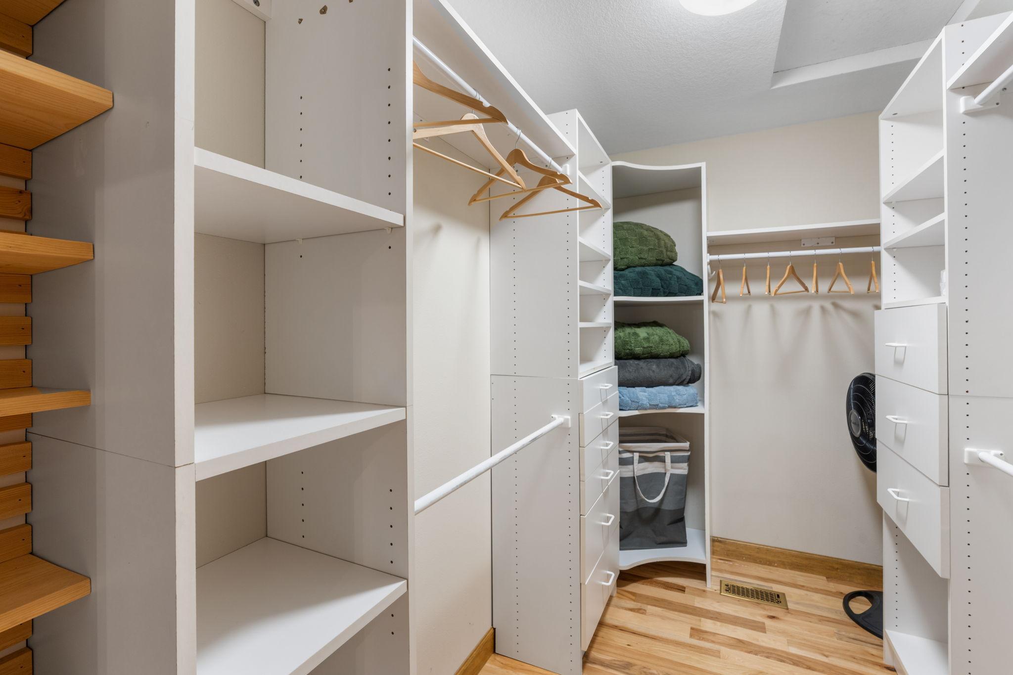 Large walk-in closet with built-in organizers