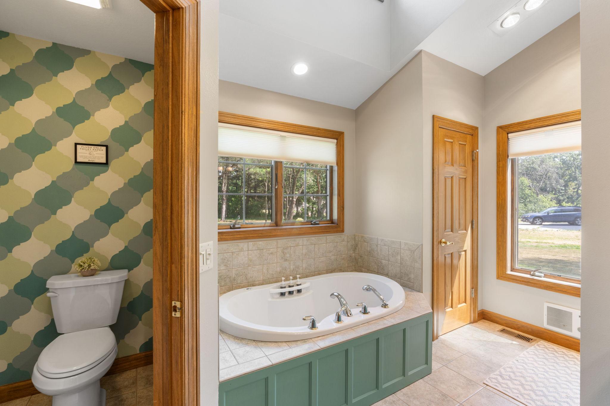 Relaxing soaker tub, toilet room and separate shower