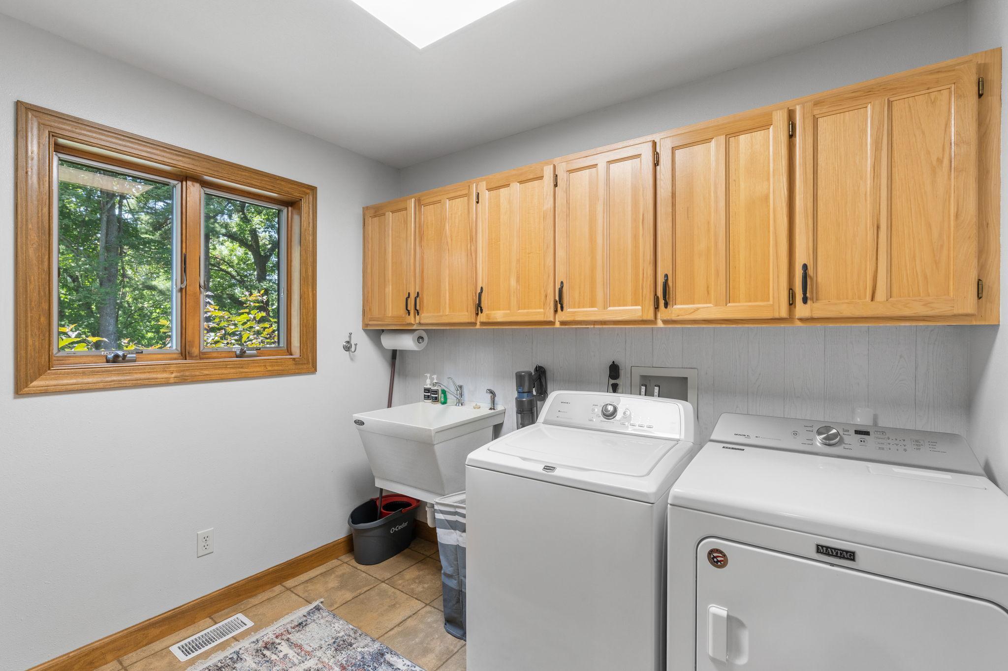 Spacious main-level laundry/mud room with closet