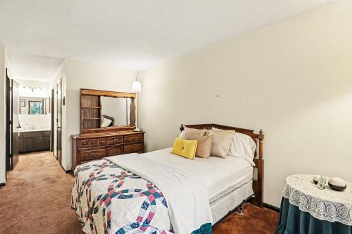 Primary Bedroom with view of primary bathroom