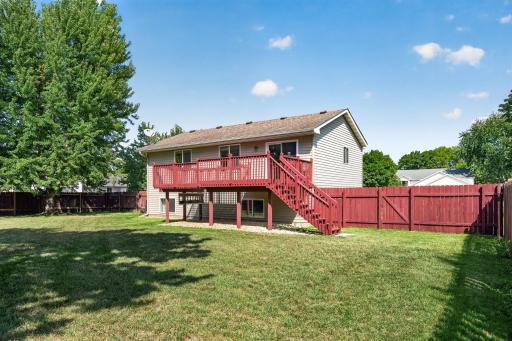 Large, open, fully fenced yard on corner lot.