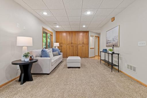 An impressive stretch of floor-to-ceiling cabinetry creates abundant storage.