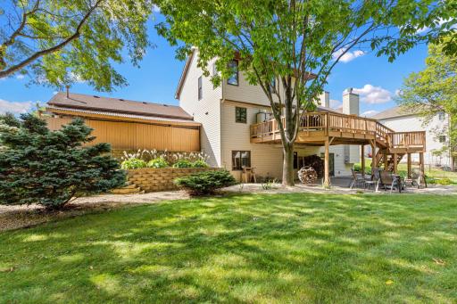 The spacious deck overlooks the yard with plenty of room for outdoor dining and entertaining.