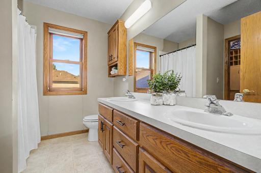 The private primary bath makes mornings easier with a double vanity and generous counter space.