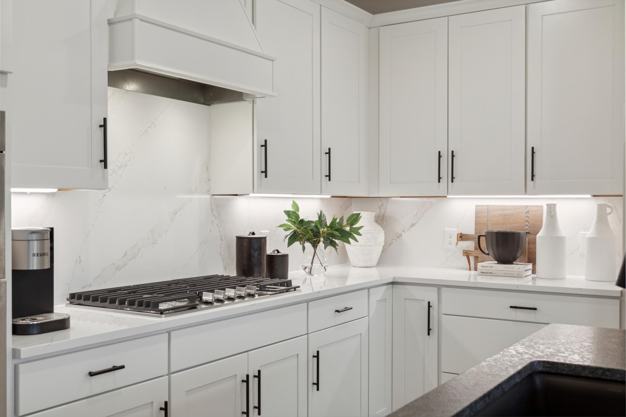 Kitchen with quartz countertops and stainless steel appliances