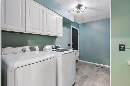 Main floor laundry room with mudroom area