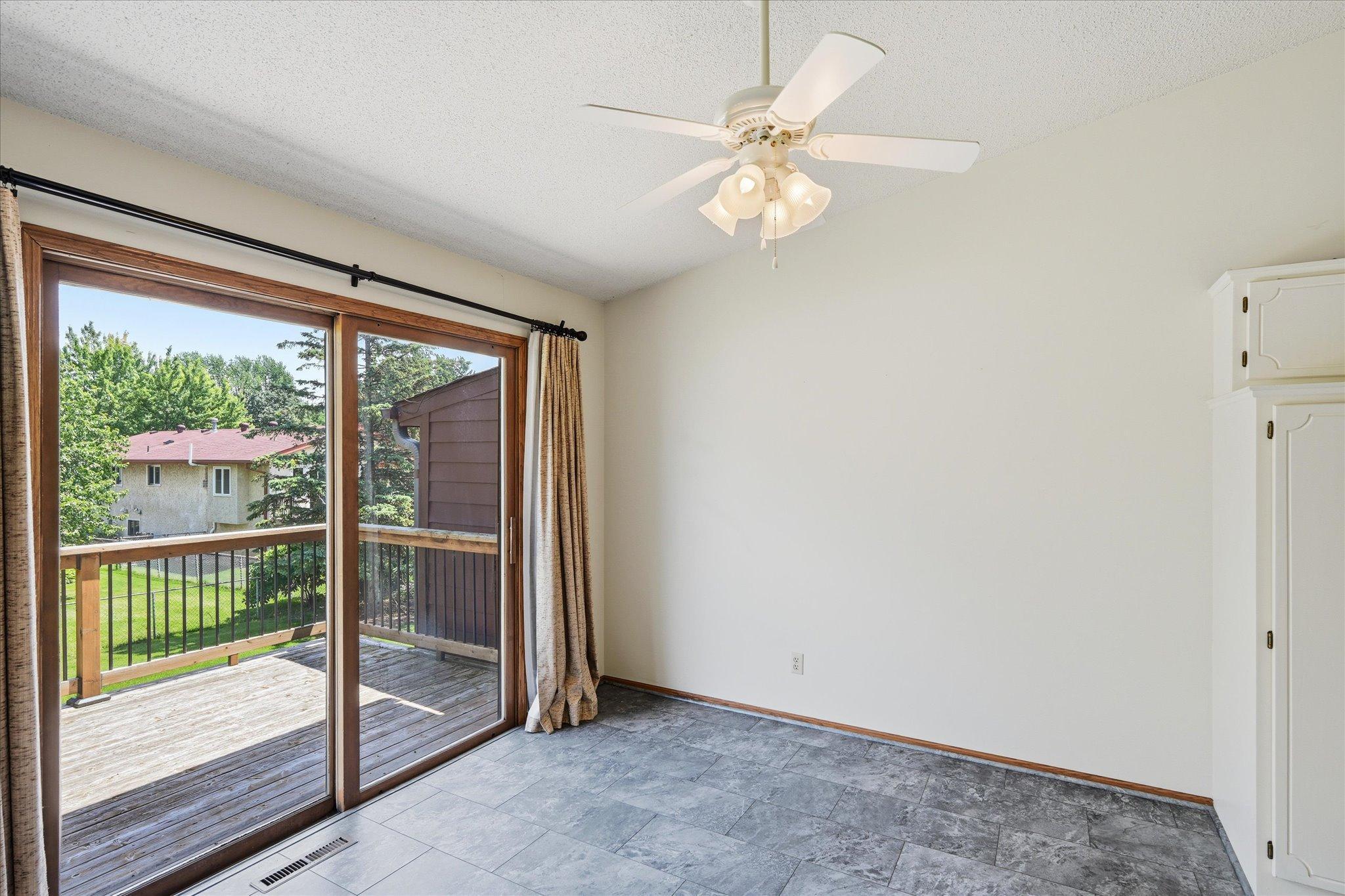 The dining area provides easy access to the deck, extending living space outdoors.