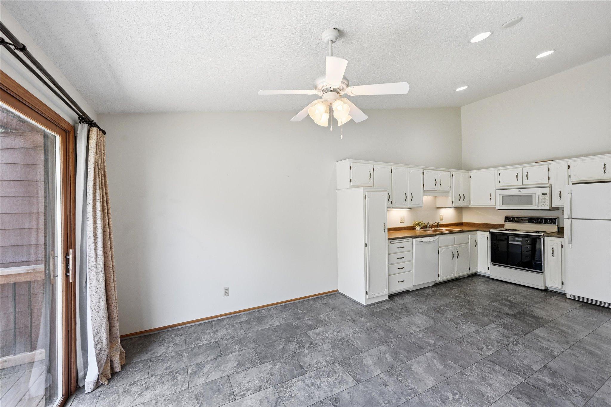 The kitchen is designed for everyday functionality with updated flooring and convenient workspace.