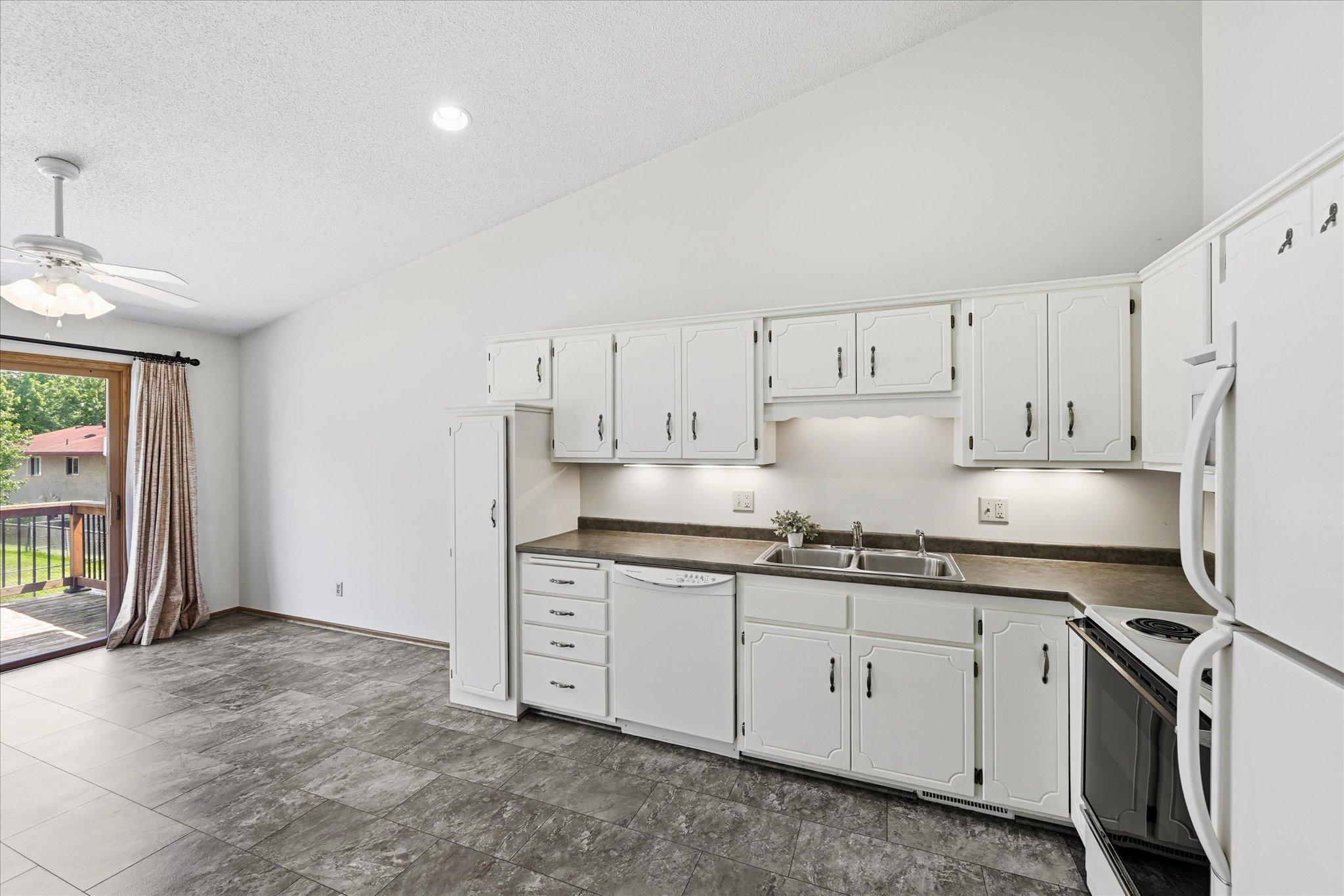The dining area provides easy access to the deck, extending living space outdoors.