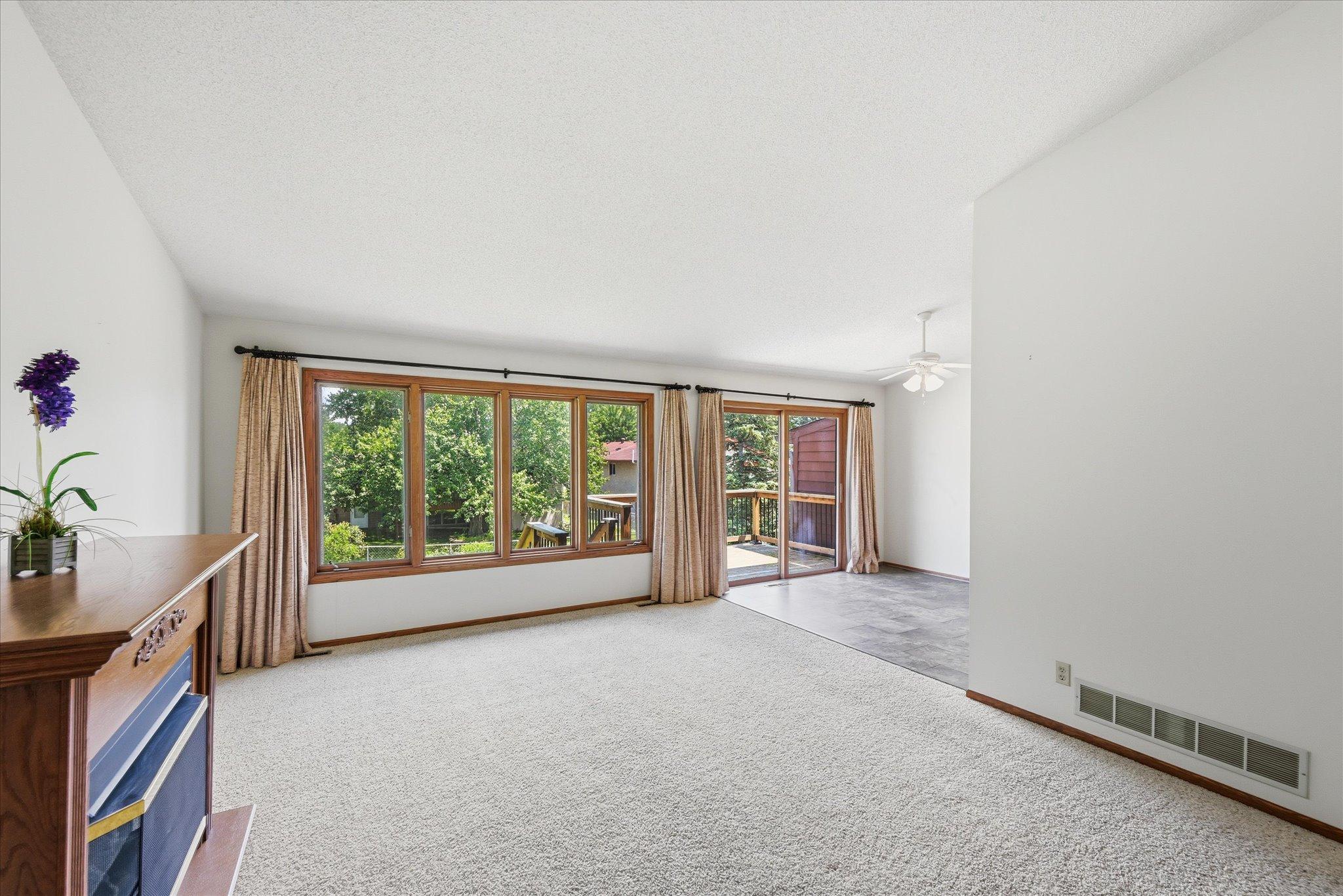 Sunlight pours through the main living spaces, highlighting the home's inviting layout.
