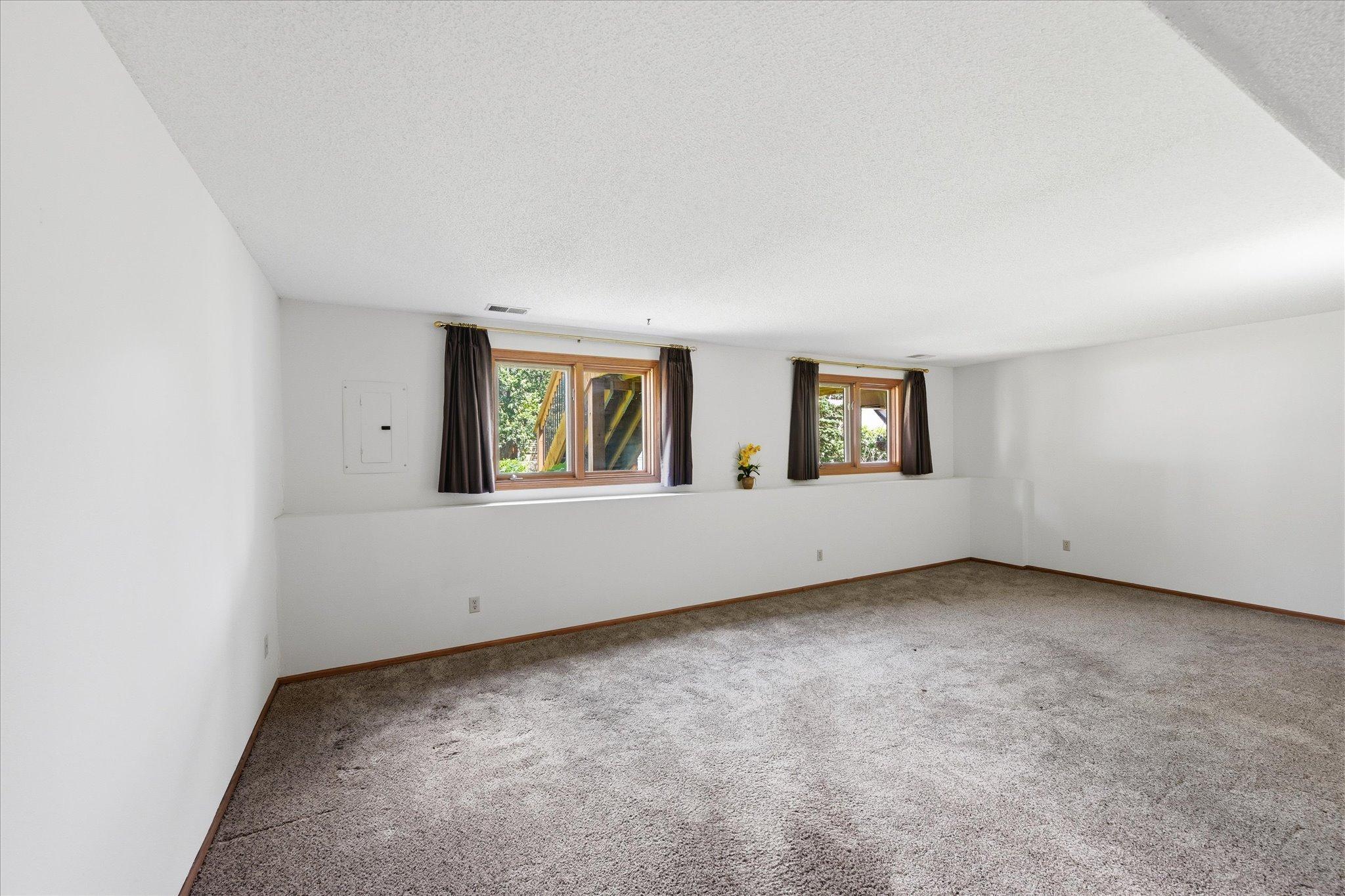 The finished lower level expands the home's living space with room to gather, work, or unwind.