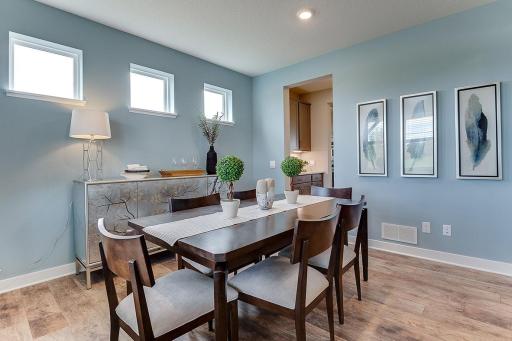 Here you can see the butler's pantry which walks through to the kitchen. There is also a separate walk-in pantry in that space. Photo of model home, colors and finishes may vary.
