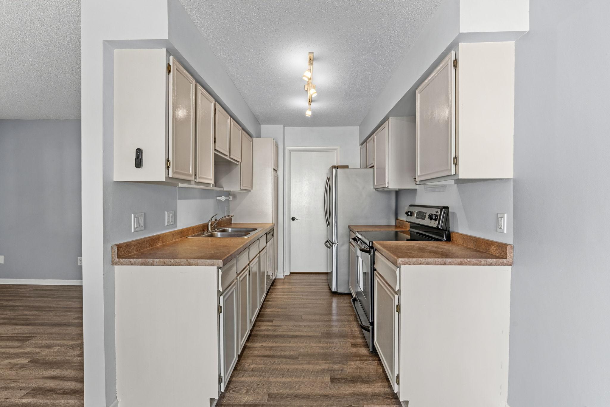 Galley kitchen with stainless steel appliances