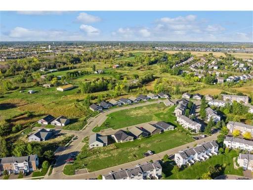 Welcome to Education Drive! Several homesites to build on or move-in ready 2 and 3 bedroom villas with 2 or 3 car garages!