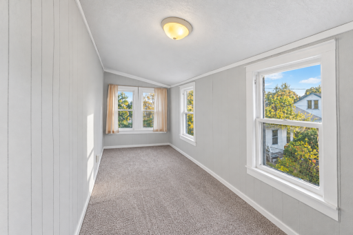 Bright Empty Sunroom with Autumn Views (1).png