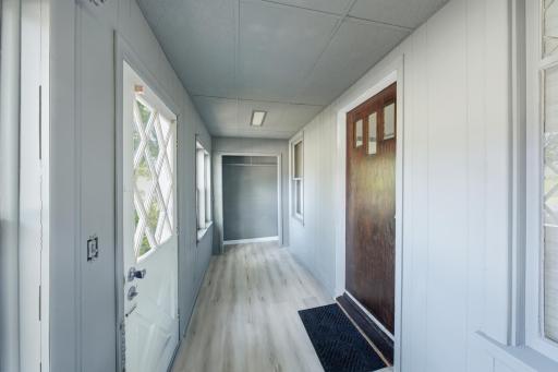 Built on 3 season porch with huge coat closet on the front of the home. New paint and floor coverings also!