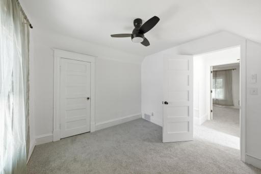 Bedroom 2 with new carpet, large walk in closet and lighted ceiling fan!