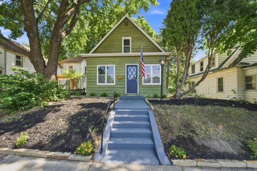 Nicely landscaped treed lot with freshly painted steps leading to updated home!