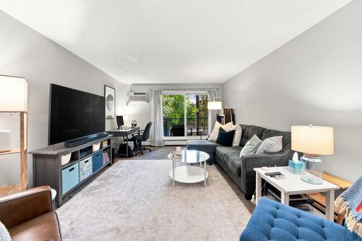 Spacious living area with hard-surface flooring and abundant natural light.