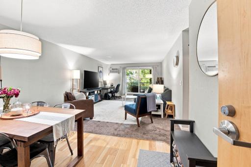 Open-concept layout seamlessly connecting the dining room to the living area.