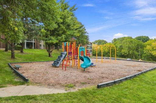 On-site community playground surrounded by green space.