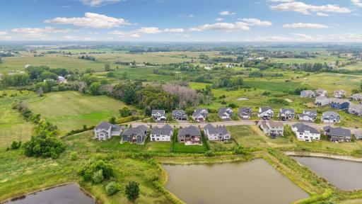 A bird’s-eye view showcases the home’s beautiful setting on a quiet no-outlet street.