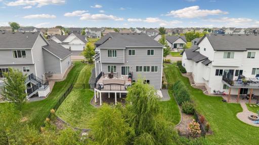 Step out back to enjoy the two-tier, maintenance-free deck and wonderful privacy with 5 acres of city-owned land beyond the property.