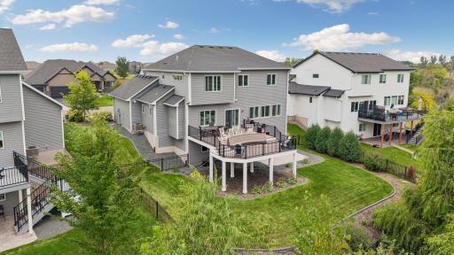Beautiful landscaping, a fully fenced yard, and a spacious two-tier deck create an outdoor space ready to enjoy.
