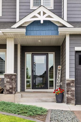 Welcome home! The covered front porch creates an inviting entrance and the perfect spot to greet guests.