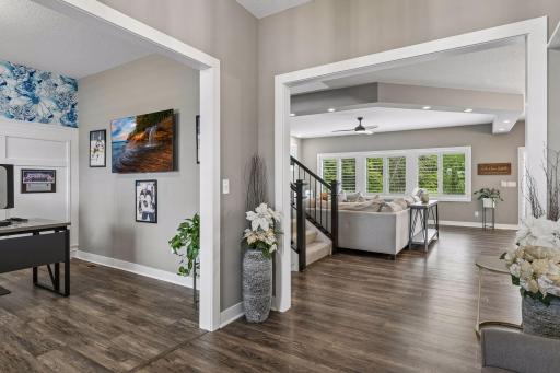Just off the foyer, a private den or office offers a flexible space for working from home, studying, or relaxing.