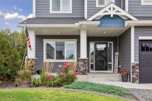 The welcoming front porch is complemented by fantastic landscaping and beautiful curb appeal.