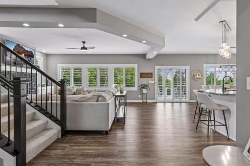 Welcome to the heart of the home! The spacious main living room features beautiful lighting and an open, inviting design.