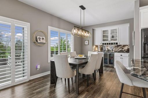The generously sized dining area is ready for a large table and plenty of guests.