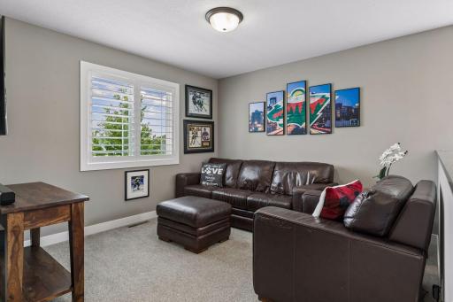 The upper-level loft provides fantastic bonus living space and offers the potential to be converted into a fourth bedroom if desired.