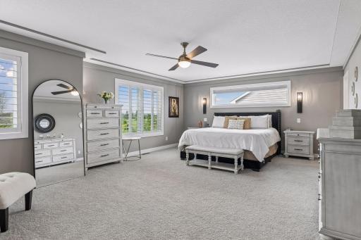 The custom-designed primary bedroom is exceptionally spacious, creating a true retreat at the end of the day.