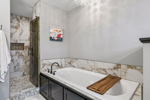 Your own place to unwind—the separate soaking tub is ready for a relaxing end to the day.