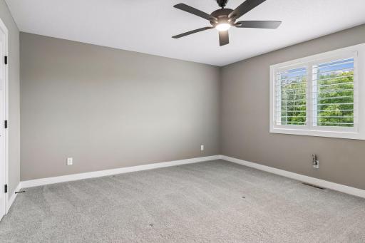 The second upper-level bedroom is generously sized with plenty of room to make the space your own.